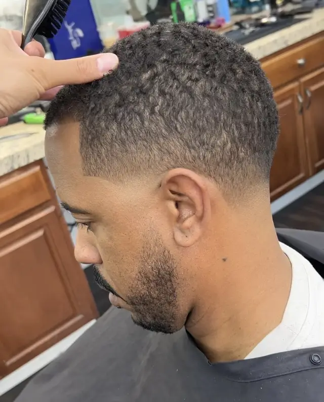 Curly crop with low taper by Mike Prosch, Palm Springs barber