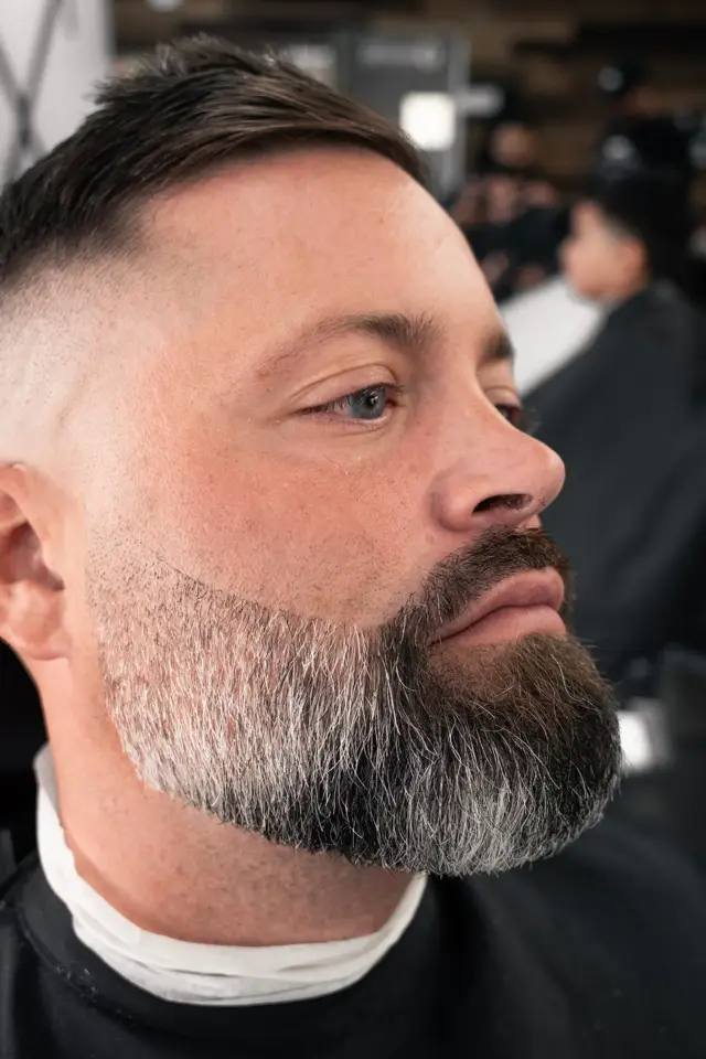 High skin fade with gray beard sculpt by Mike Prosch, Palm Springs barber