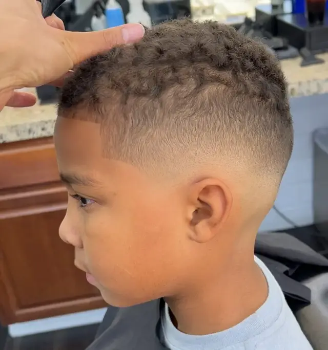 Kids curly top with skin fade by Mike Prosch, Palm Springs barber