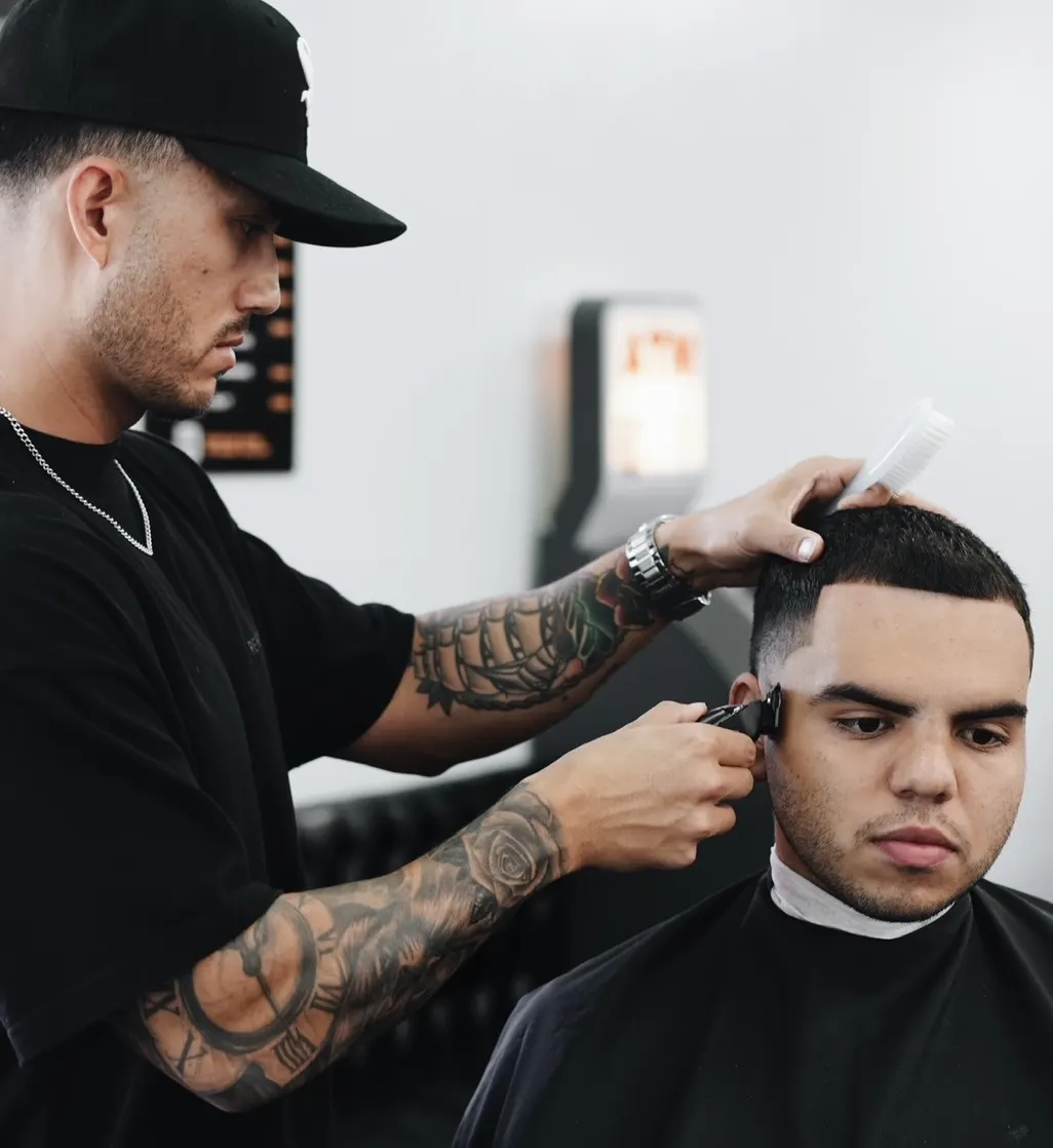 Mike Prosch, Palm Springs barber, giving a client a skin fade